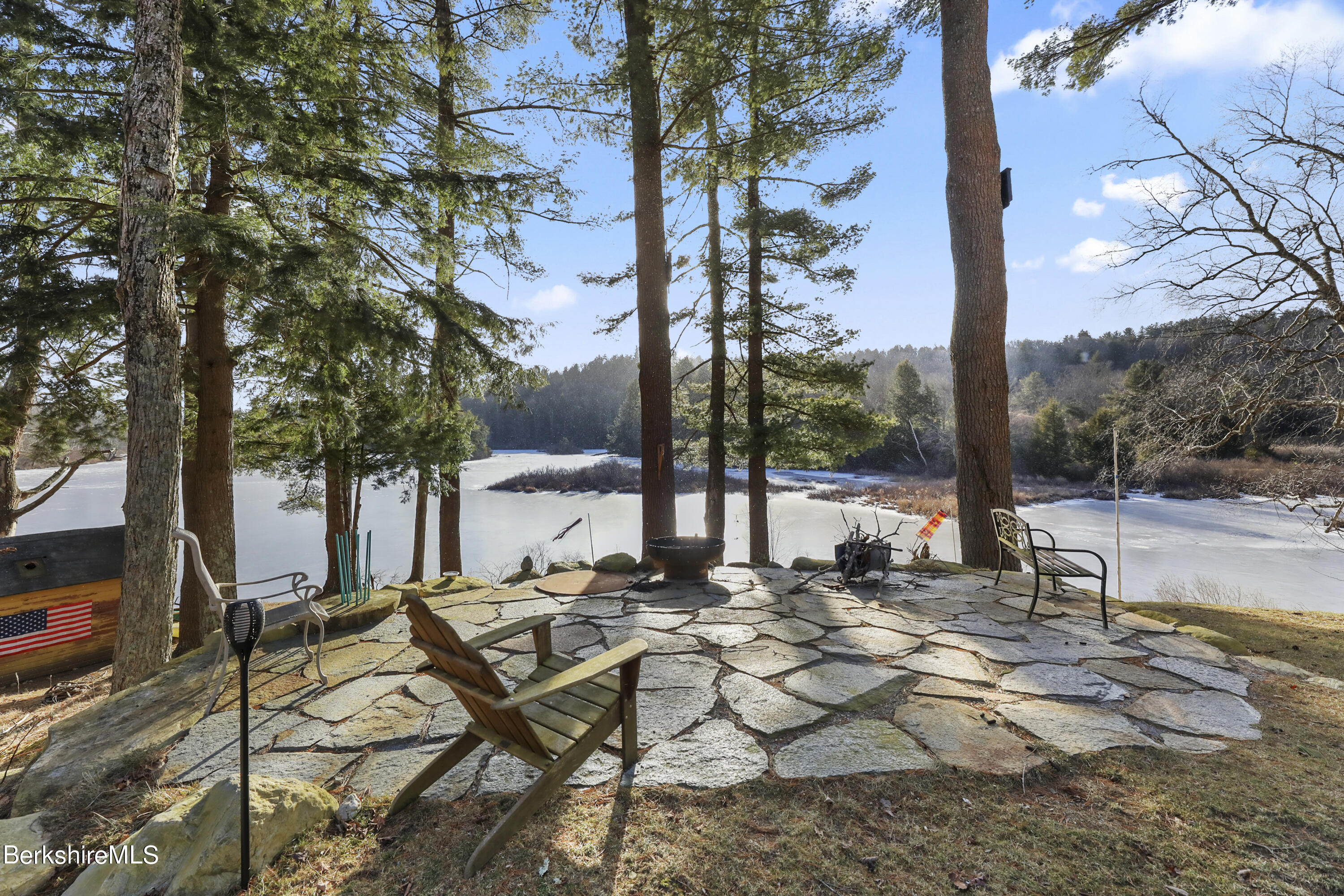 a view of a backyard with a sitting area