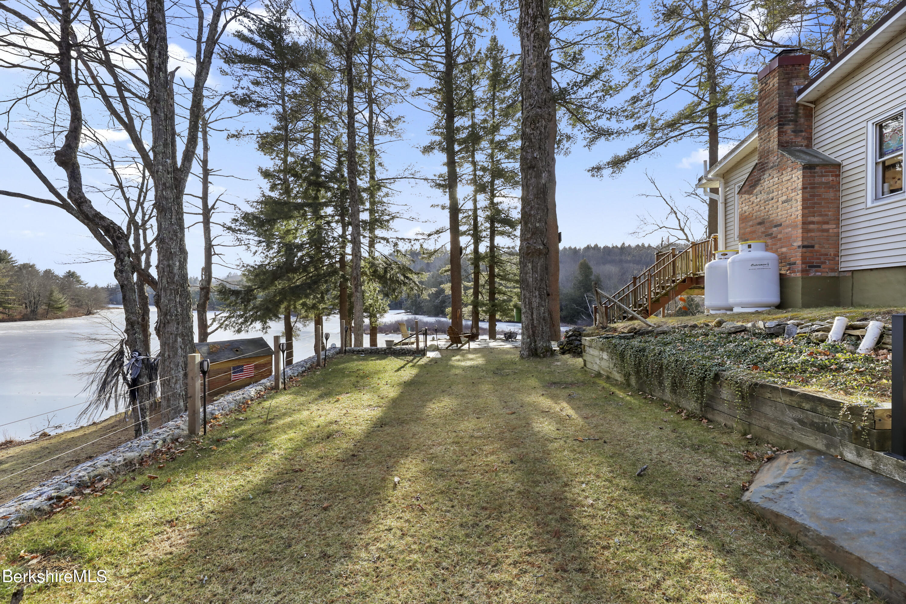 1831 North Main Road Otis, MA 01253 - Photo 20 of 69 a view of a yard with large trees