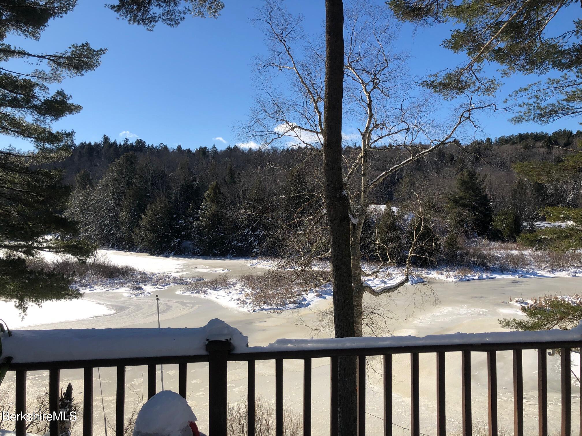 1831 North Main Road Otis, MA 01253 - Photo 24 of 69 a view of a yard from a balcony
