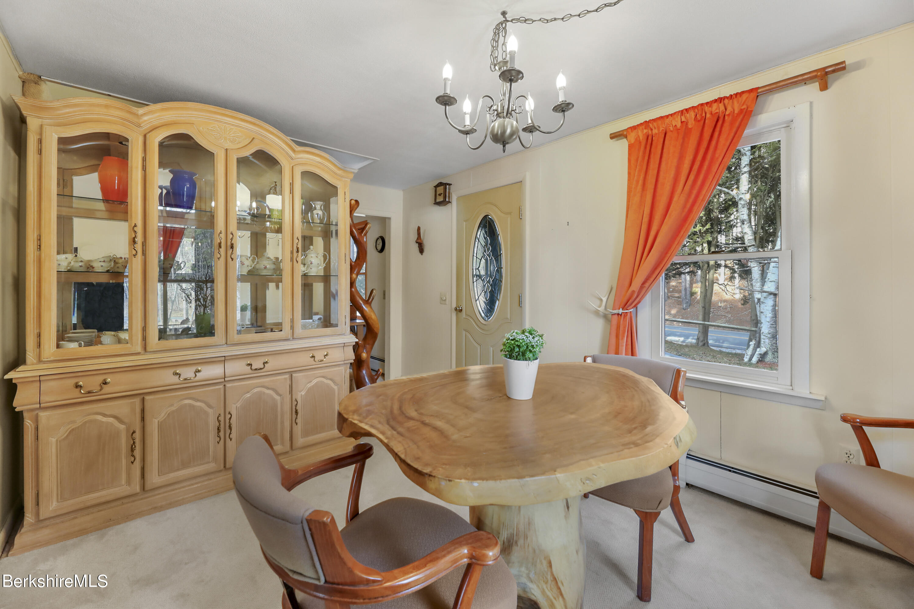 1831 North Main Road Otis, MA 01253 - Photo 27 of 69 a view of a dining room with furniture window and outside view