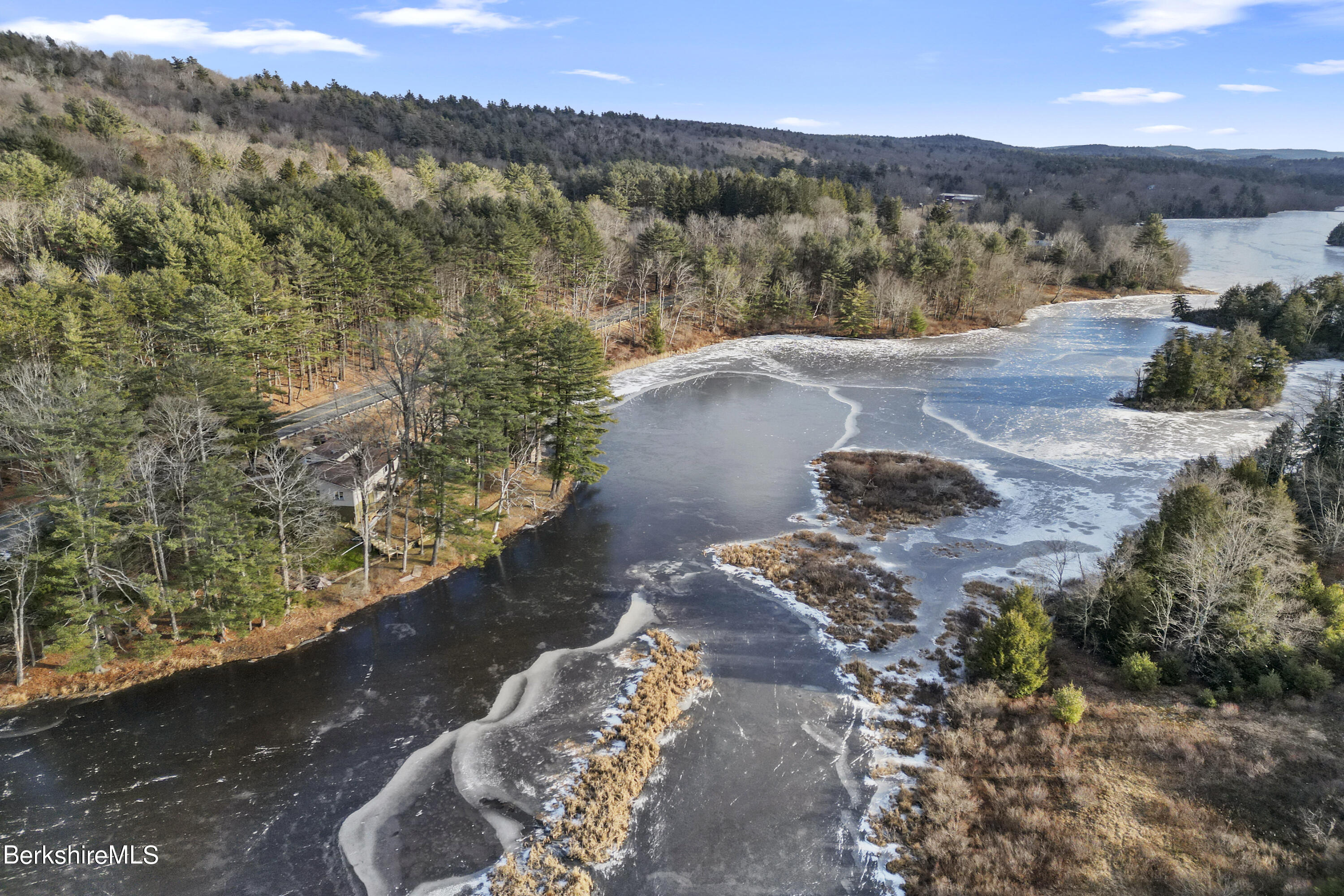 1831 North Main Road Otis, MA 01253 - Photo 3 of 69 a view of a lake with mountain