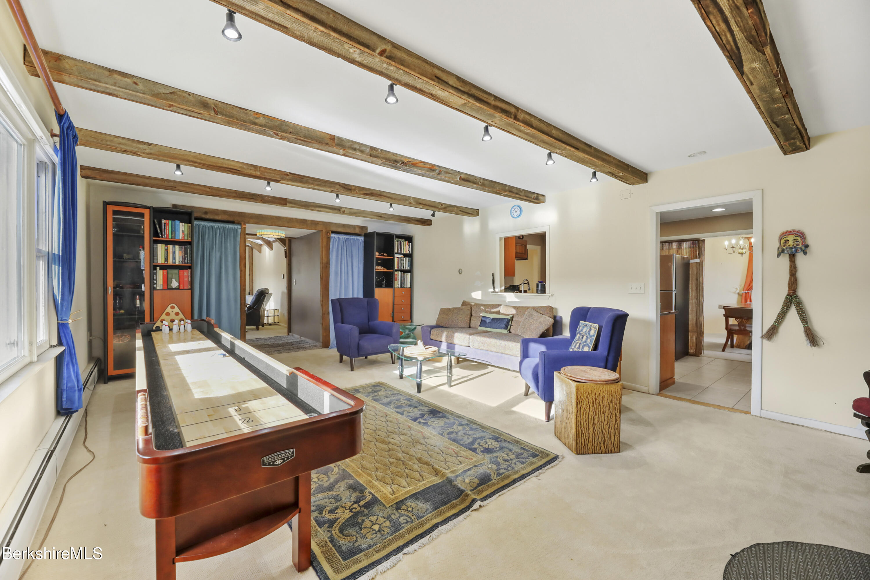1831 North Main Road Otis, MA 01253 - Photo 33 of 69 a living room with furniture a rug and white walls