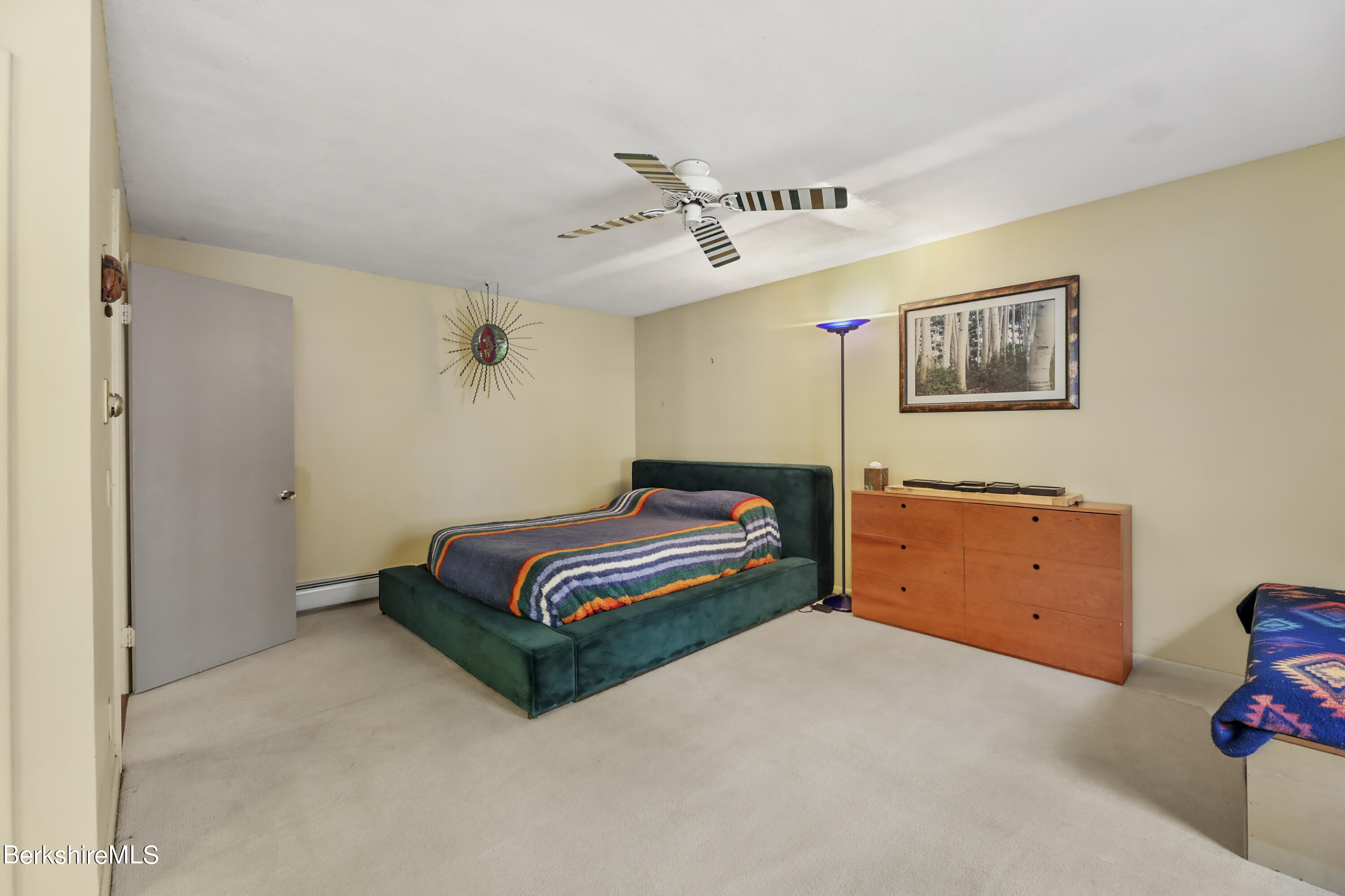 1831 North Main Road Otis, MA 01253 - Photo 41 of 69 a bedroom with a bed and cabinets