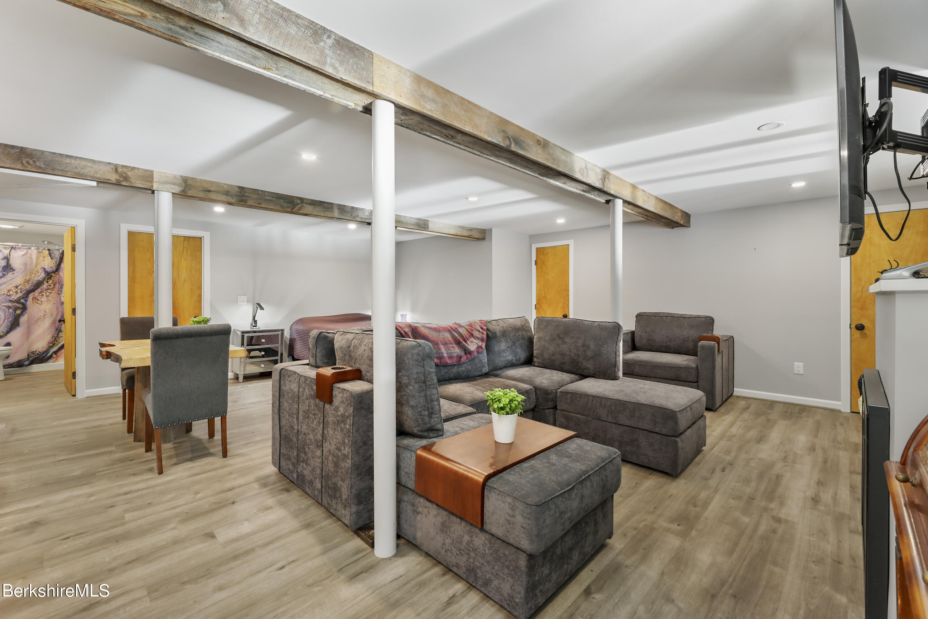 1831 North Main Road Otis, MA 01253 - Photo 56 of 69 a living room with furniture and wooden floor