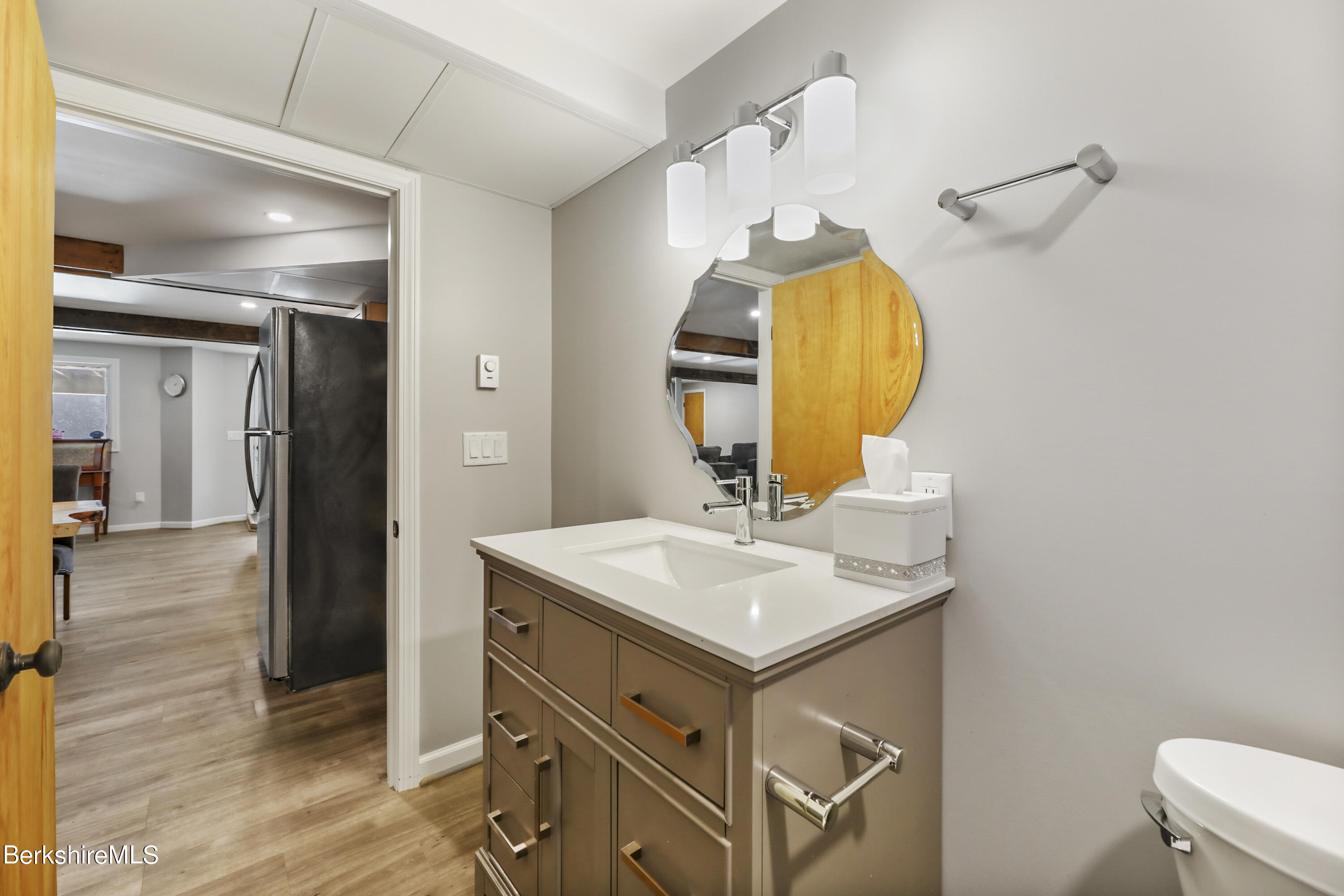 1831 North Main Road Otis, MA 01253 - Photo 65 of 69 a bathroom with a sink mirror and vanity