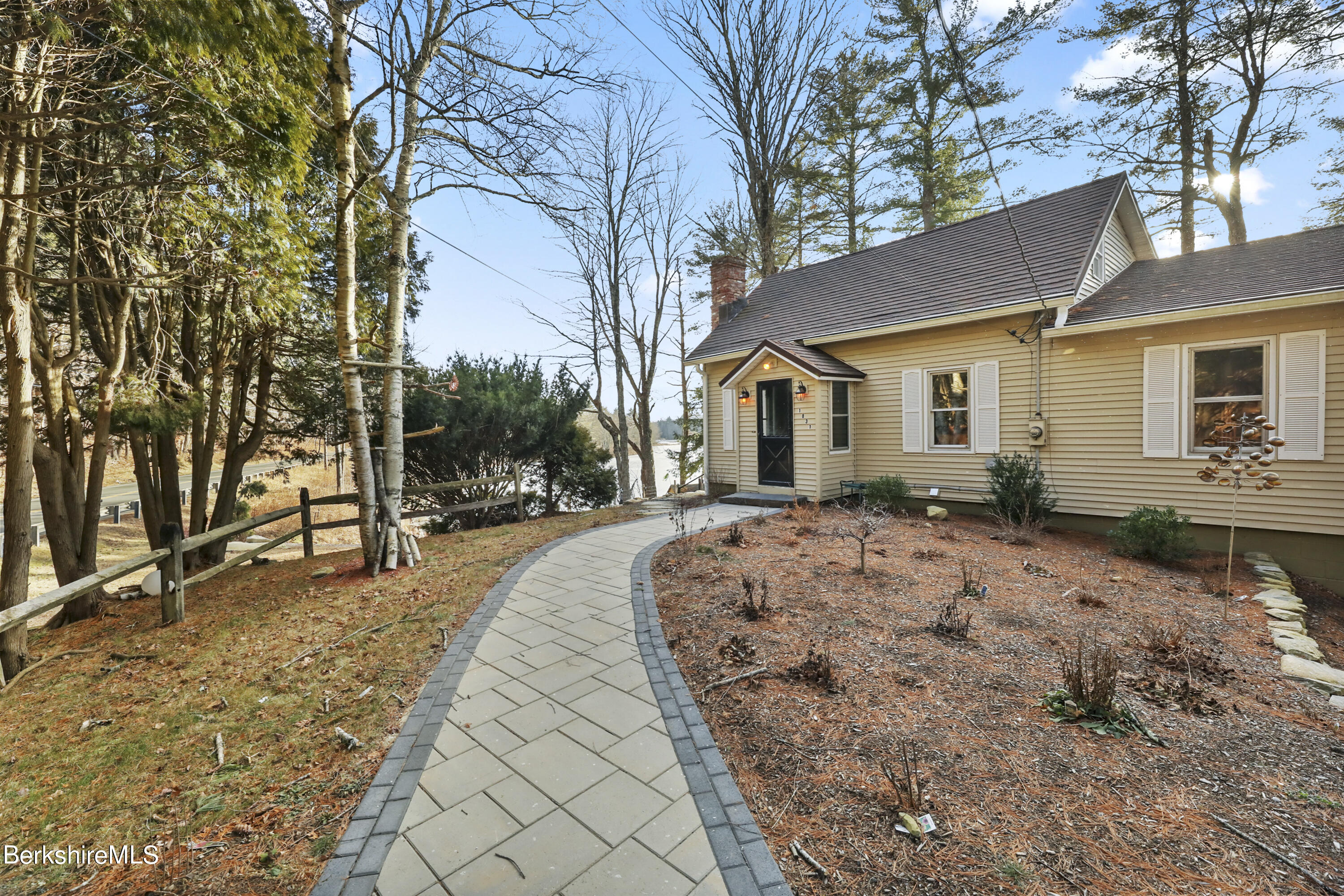 1831 North Main Road Otis, MA 01253 - Photo 9 of 69 a front view of a house with a yard