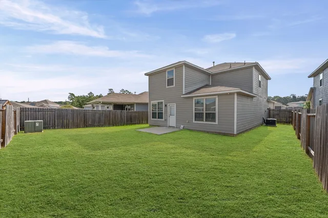 a backyard of a house with lots of green space
