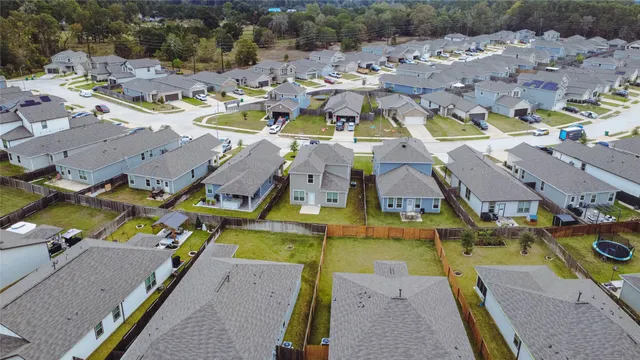 an aerial view of a house with a swimming pool