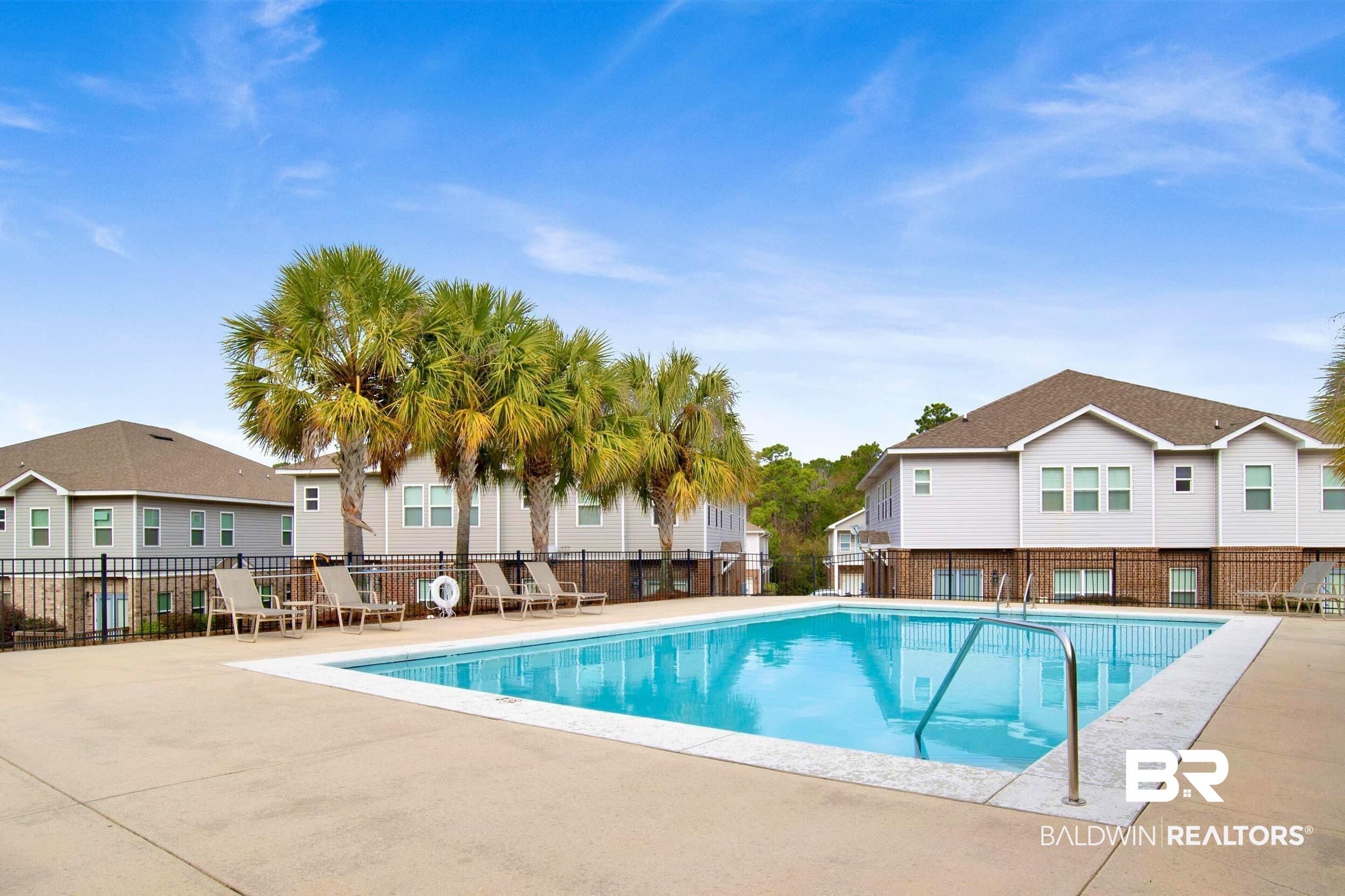 6811 Spaniel Drive, Unit C Daphne, AL 36527 - Photo 6 of 33 Community pool with a patio area