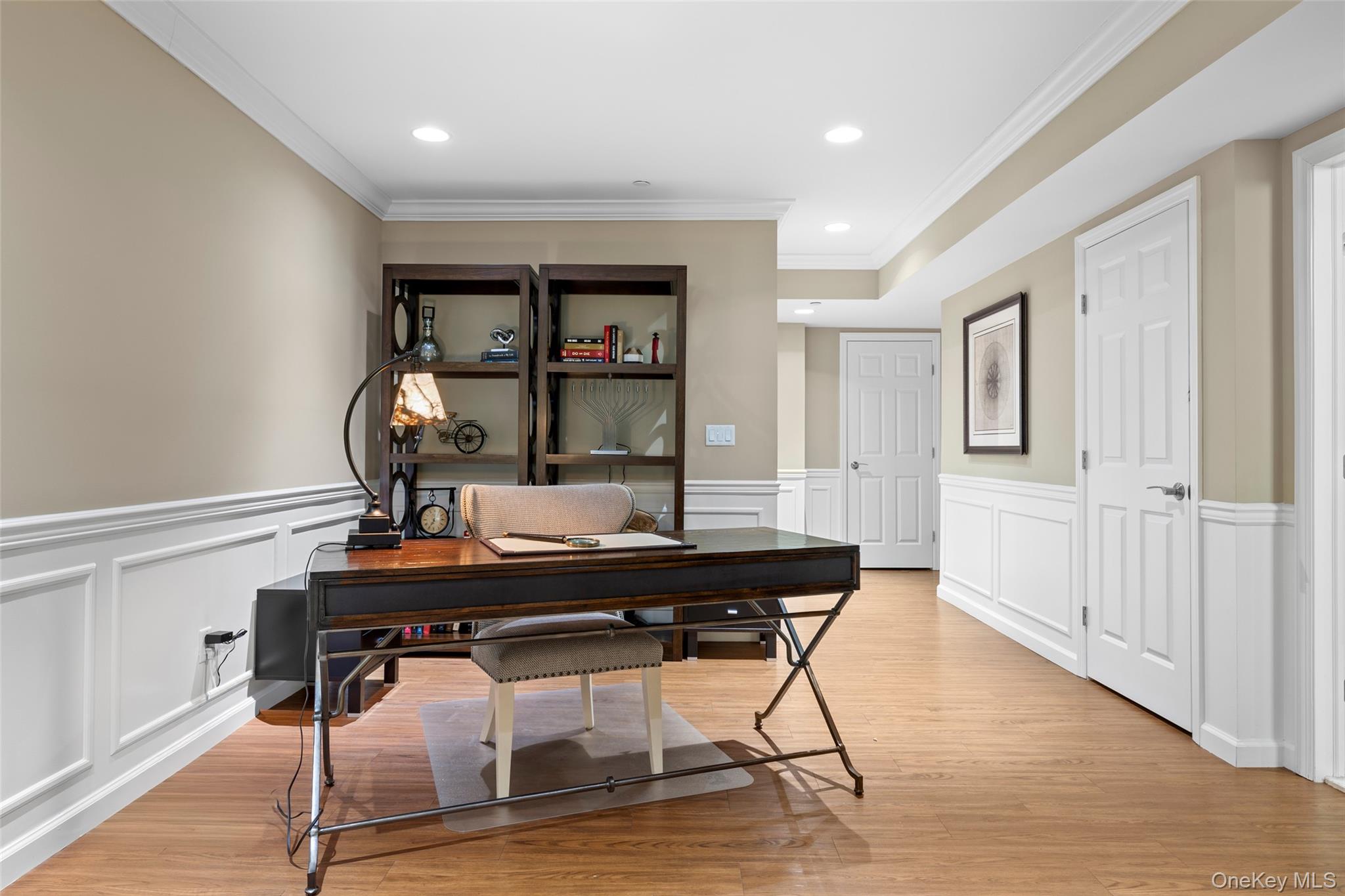 56 Spring Drive Seaford, NY 11783 - Photo 19 of 42 a view of a workspace with furniture and wooden floor