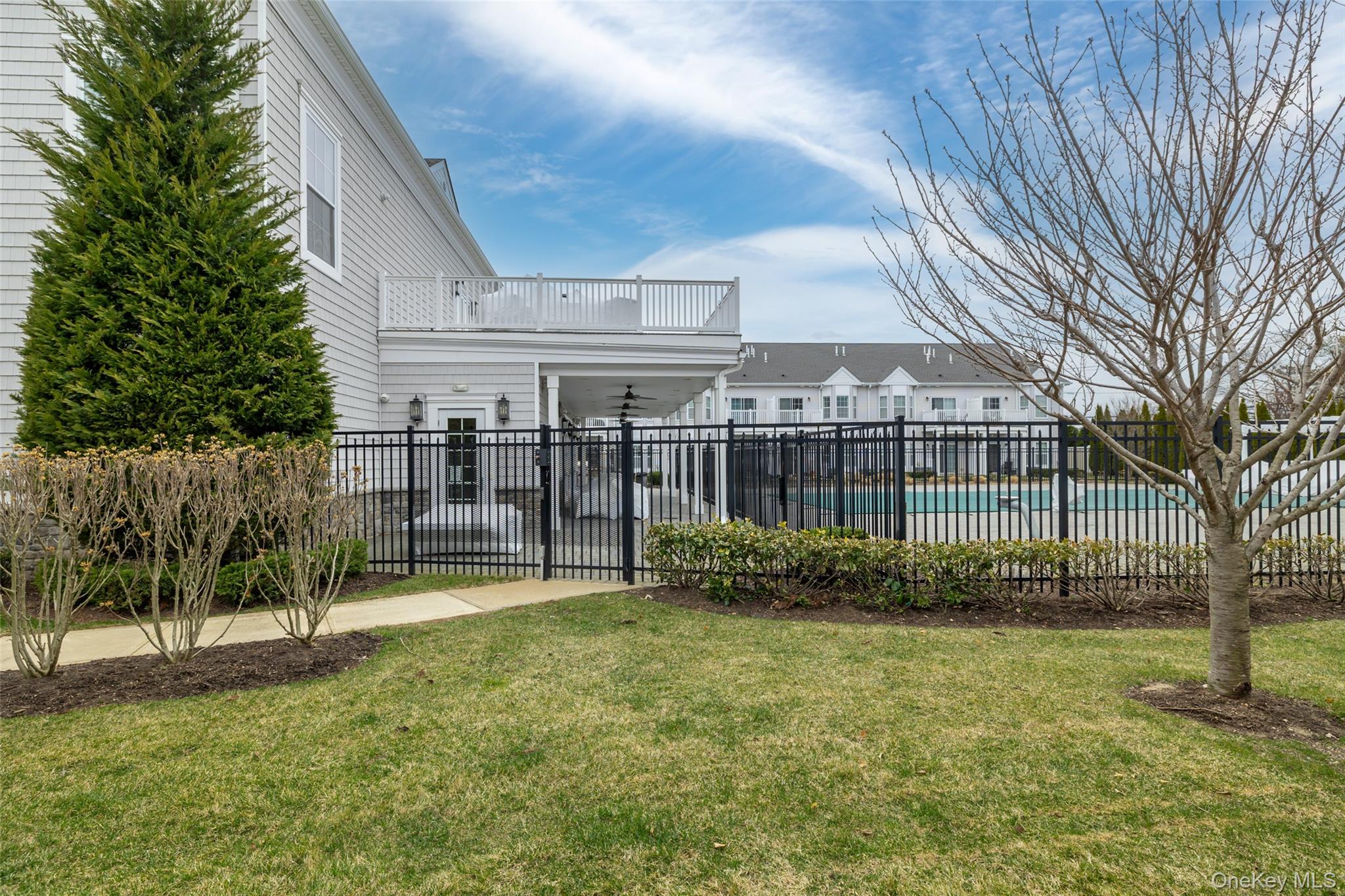 56 Spring Drive Seaford, NY 11783 - Photo 27 of 42 a view of a backyard with a garden and plants