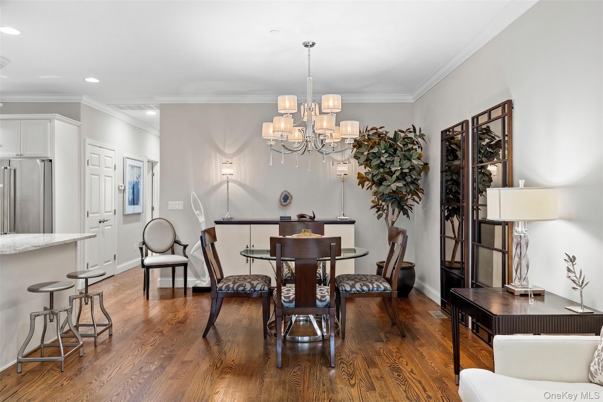 56 Spring Drive Seaford, NY 11783 - Photo 5 of 42 a view of a dining room with furniture window and wooden floor