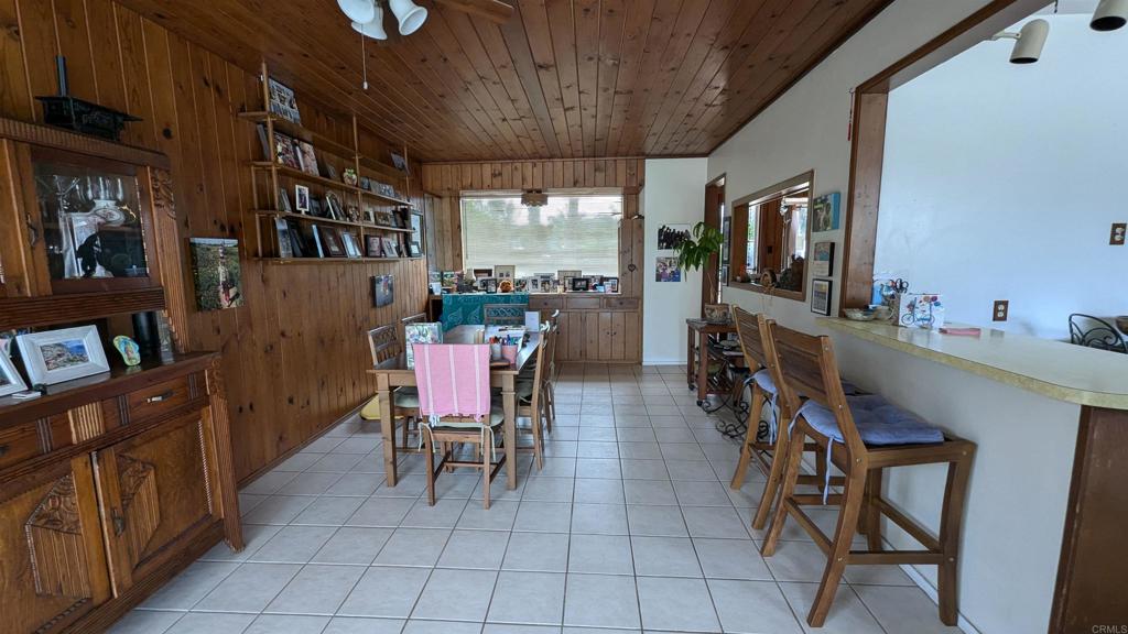 5158 Los Robles Drive Carlsbad, CA 92008 - Photo 13 of 31 a dining room with furniture and window