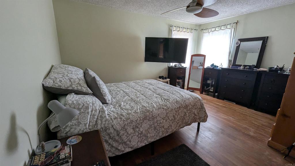 5158 Los Robles Drive Carlsbad, CA 92008 - Photo 18 of 31 a bedroom with a bed and a flat screen tv