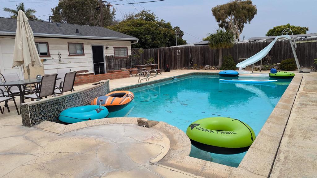 5158 Los Robles Drive Carlsbad, CA 92008 - Photo 21 of 31 a swimming pool with outdoor seating and yard