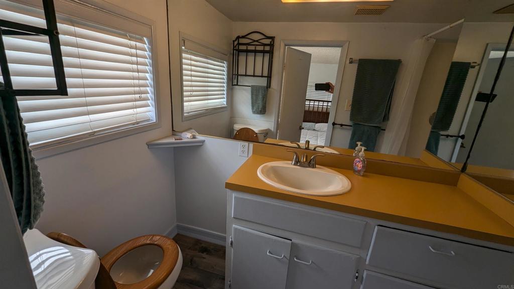 5158 Los Robles Drive Carlsbad, CA 92008 - Photo 24 of 31 a bathroom with a sink and a mirror