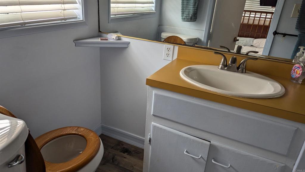 5158 Los Robles Drive Carlsbad, CA 92008 - Photo 25 of 31 a bathroom with a sink and a toilet