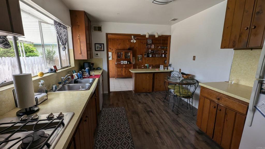 5158 Los Robles Drive Carlsbad, CA 92008 - Photo 7 of 31 a living room with furniture and a flat screen tv