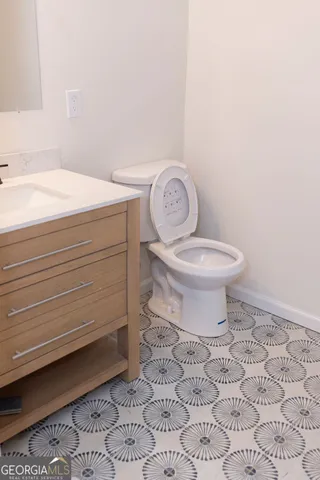 a bathroom with a toilet and a sink