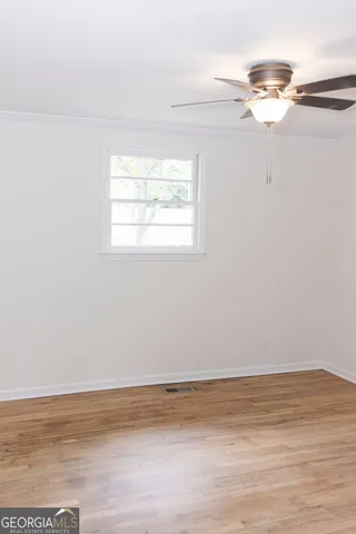 a view of room and wooden floor