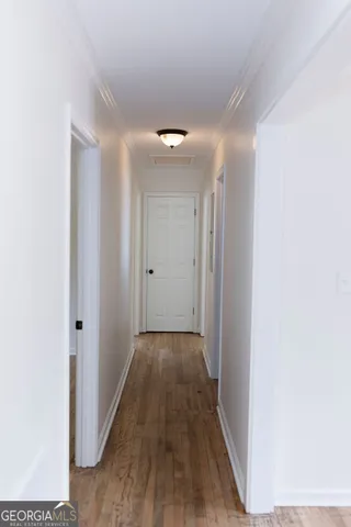 a view of balcony with wooden floor and fence