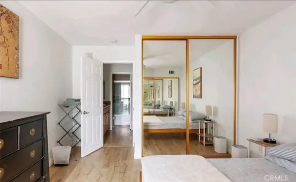 a living room with furniture a dining table and a large window