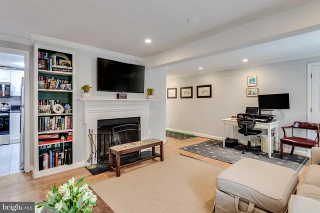 a bathroom with a granite countertop sink a large mirror and vanity