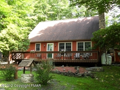 199 Fawn Road Pocono Lake, PA 18347 - Photo 1 of 31 a front view of a house with garden and patio