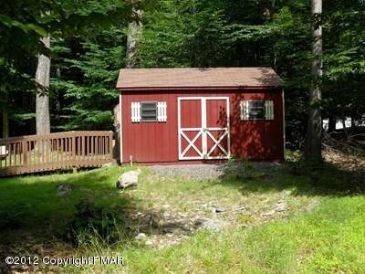 199 Fawn Road Pocono Lake, PA 18347 - Photo 7 of 31 a front view of a house with garden