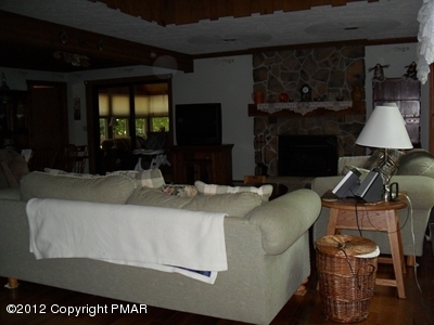 199 Fawn Road Pocono Lake, PA 18347 - Photo 8 of 31 a living room with furniture and a fireplace