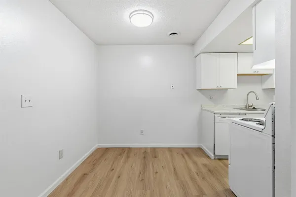 a kitchen with stainless steel appliances granite countertop a stove and a refrigerator
