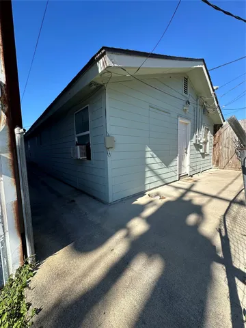 a view of front door and wooden walk in closet