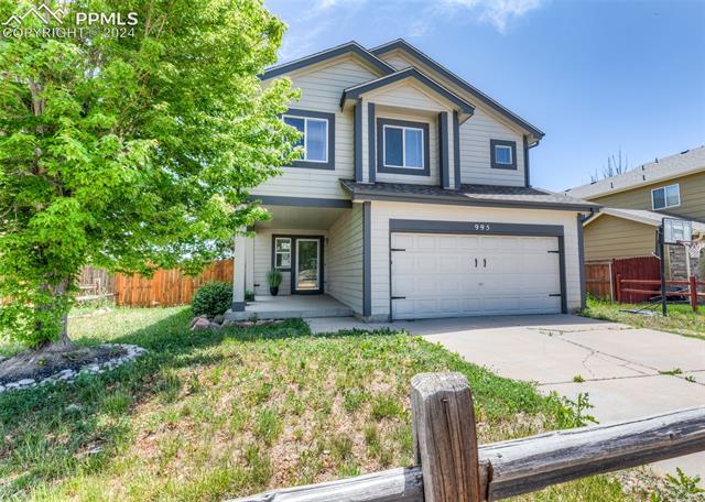 995 Winebrook Way Fountain, CO 80817 - Photo 2 of 44 Front facade with a front yard and a garage