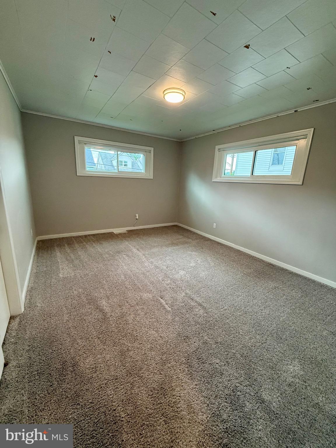 719 East Oldtown Road Cumberland, MD 21502 - Photo 11 of 20 an empty room with a empty space and windows