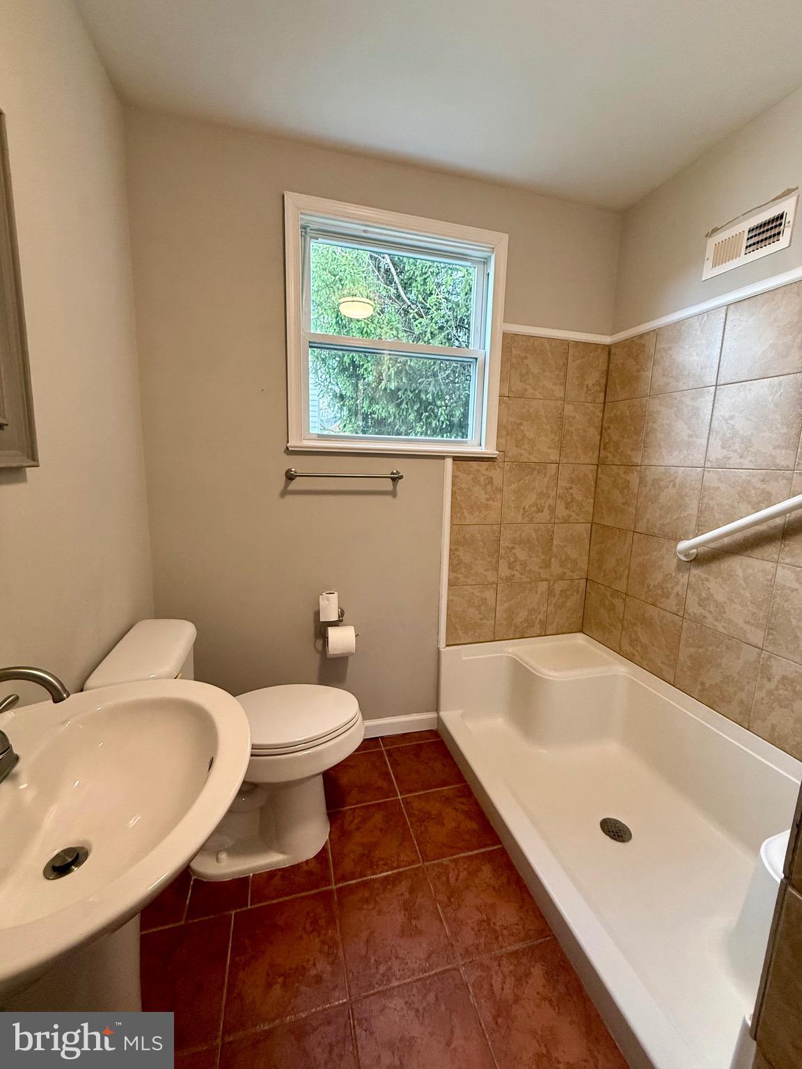 719 East Oldtown Road Cumberland, MD 21502 - Photo 13 of 20 a bathroom with a sink and a toilet
