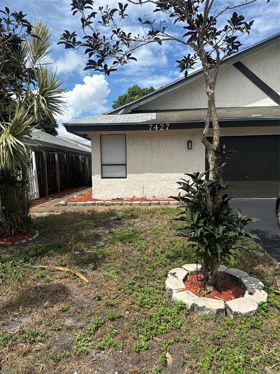 7427 Southwest 13th Street North Lauderdale, FL 33068 - Photo 2 of 49 a vase of flowers sitting on a floor