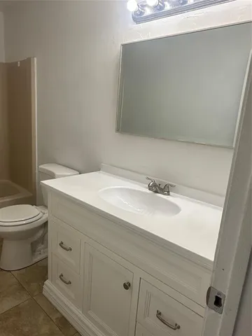 a bathroom with a sink and a toilet