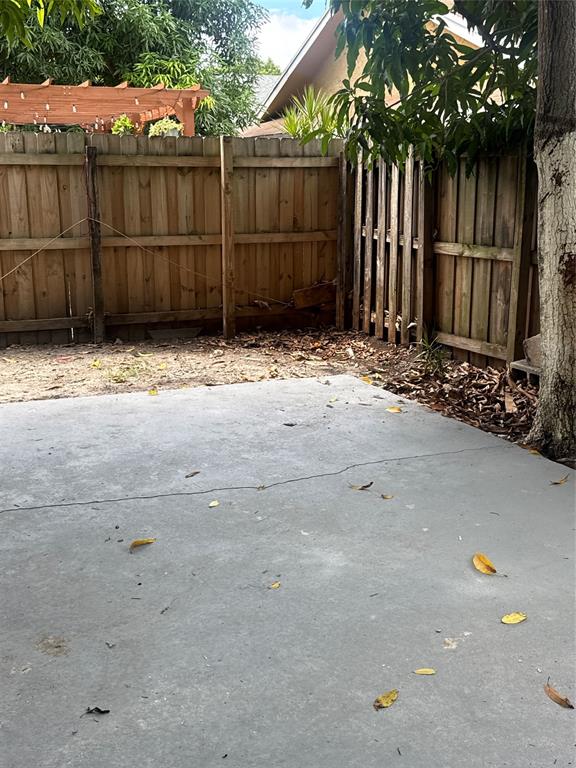 7427 Southwest 13th Street North Lauderdale, FL 33068 - Photo 36 of 49 a view of a house with a wooden fence