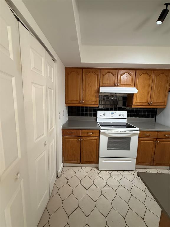 7427 Southwest 13th Street North Lauderdale, FL 33068 - Photo 41 of 49 a kitchen with a stove and a microwave