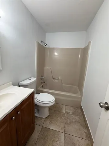 a bathroom with a sink toilet and a mirror