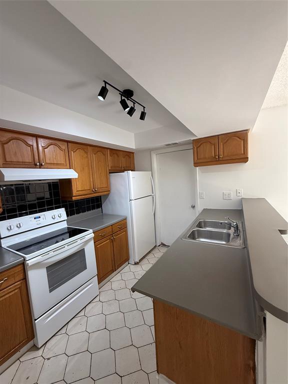 7427 Southwest 13th Street North Lauderdale, FL 33068 - Photo 47 of 49 a kitchen with a stove and a refrigerator