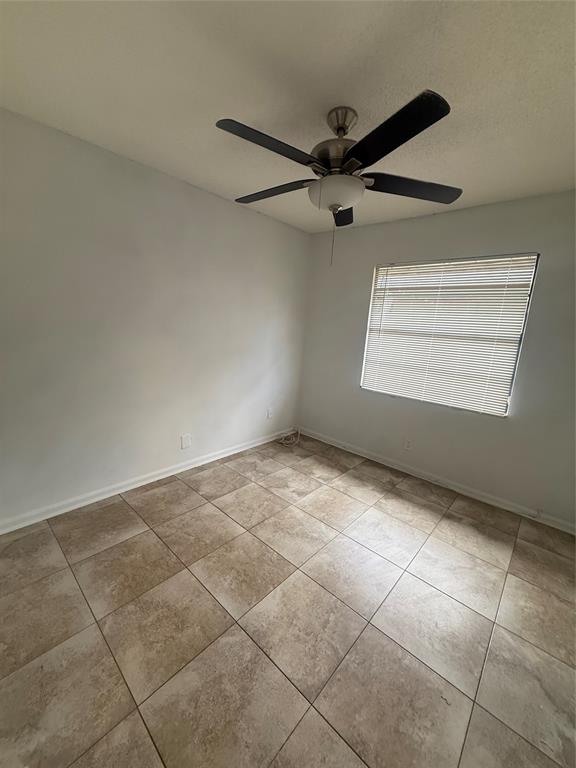 7427 Southwest 13th Street North Lauderdale, FL 33068 - Photo 5 of 49 a view of an empty room with a window