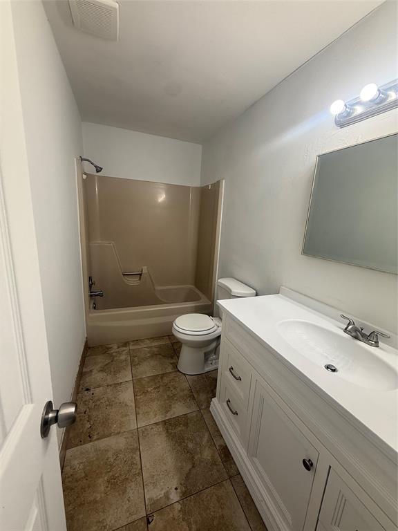 7427 Southwest 13th Street North Lauderdale, FL 33068 - Photo 7 of 49 a bathroom with a granite countertop sink a toilet a mirror and shower