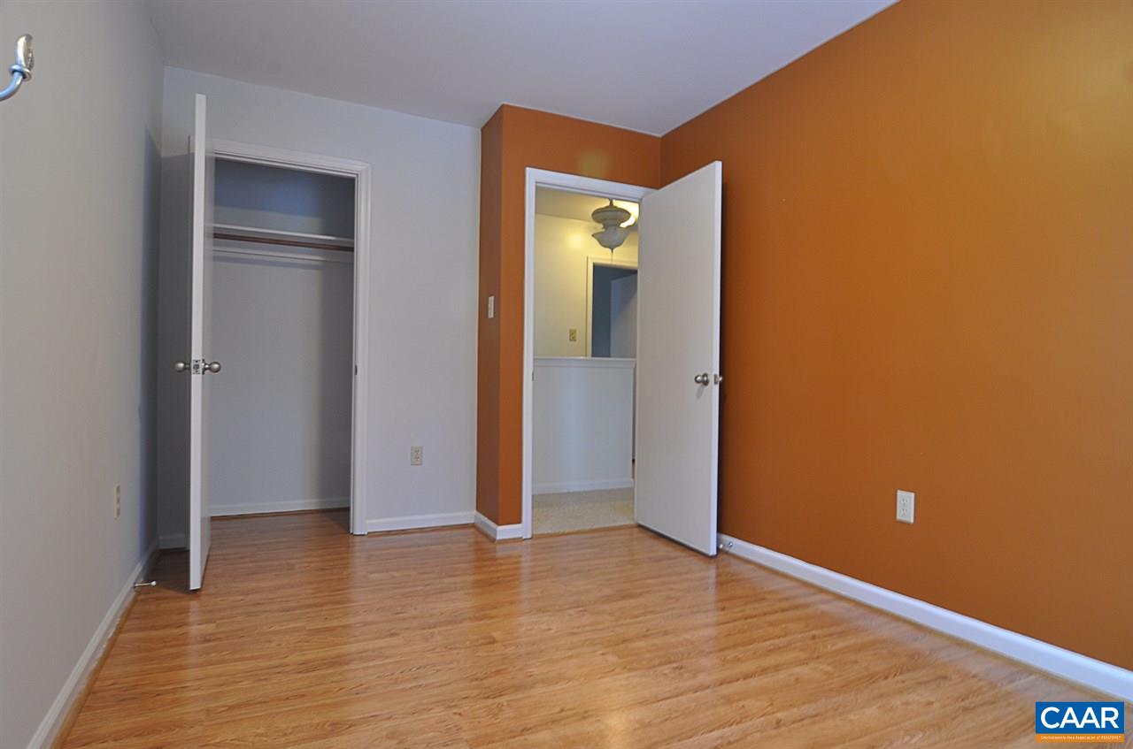 335 Larkspur Road Ruckersville, VA 22968 - Photo 14 of 31 a view of an empty room with wooden floor and closet