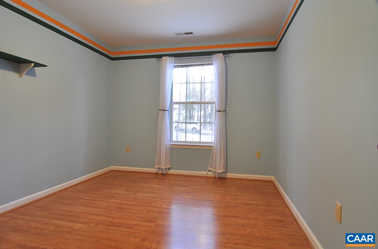 335 Larkspur Road Ruckersville, VA 22968 - Photo 15 of 31 a view of empty room with wooden floor and fan