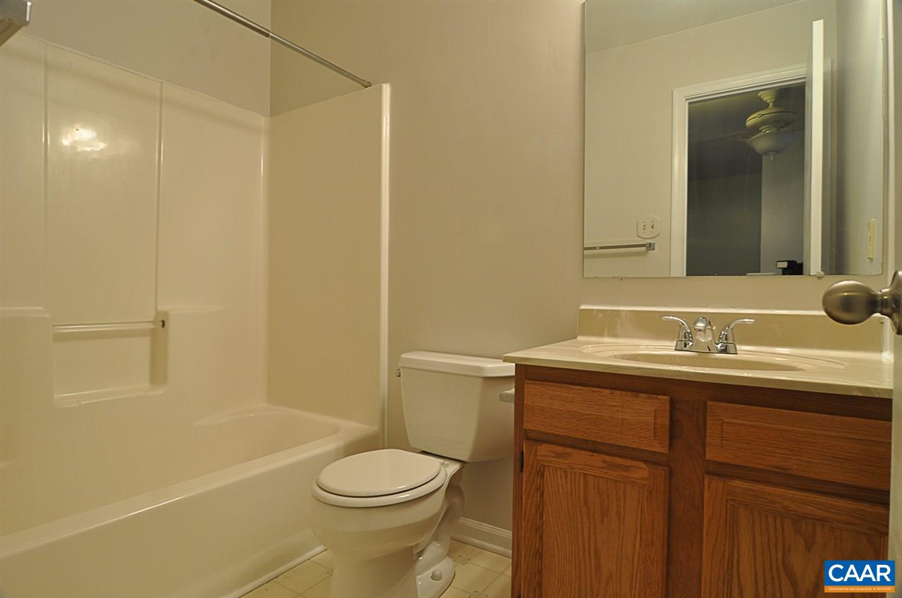 335 Larkspur Road Ruckersville, VA 22968 - Photo 16 of 31 a bathroom with a granite countertop sink toilet and shower