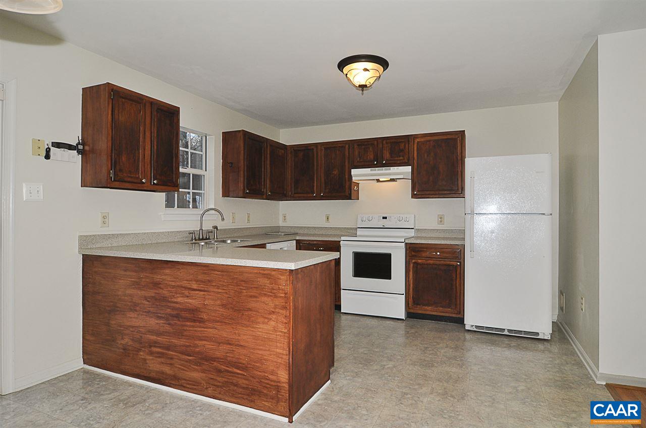 335 Larkspur Road Ruckersville, VA 22968 - Photo 8 of 31 a kitchen with a sink stove and refrigerator