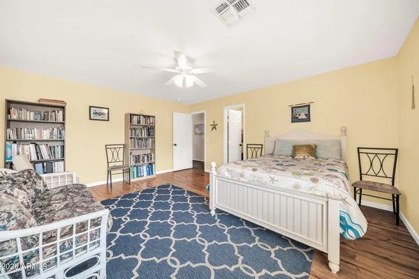 a bedroom with double bed and a window