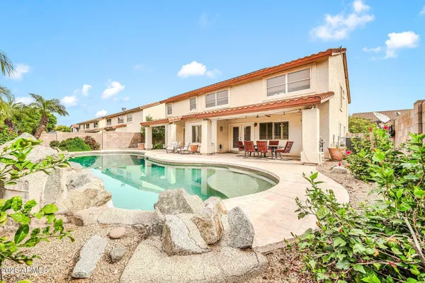 a front view of a house with swimming pool
