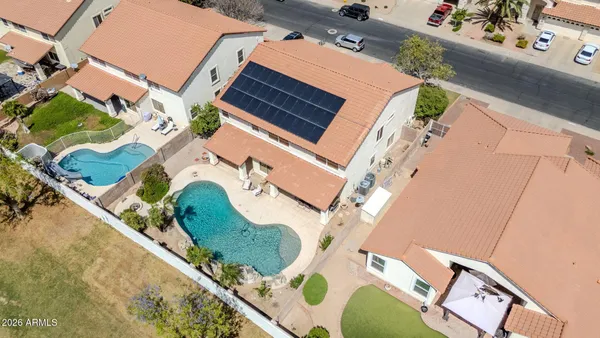a view of a swimming pool with a patio
